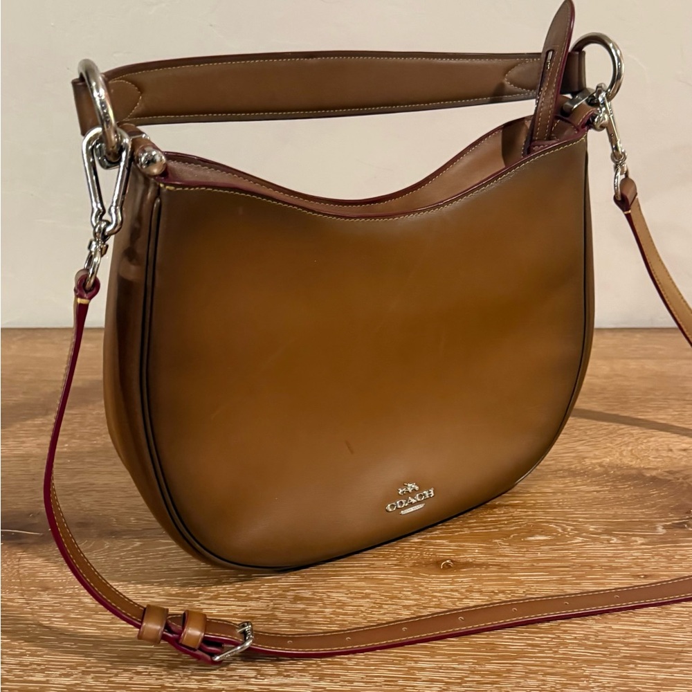 Coach Nomad Hobo Crossbody
brown glovetanned leather with red edgepaint